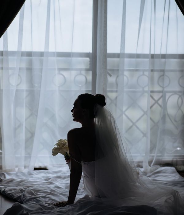 Woman in a graceful morning yoga pose by the window.